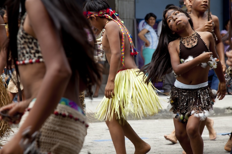 A group from an Indigenous Kichwa community performs dances in costumes that are unique to their community, demonstrating different cultural practices that exist within the Pastaza province, Ecuador.