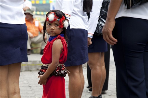 A young girl from an Achuar community participates in a parade in Puyo, Ecuador to celebrate the many Indigenous cultures and traditions that live in the Pastaza province.