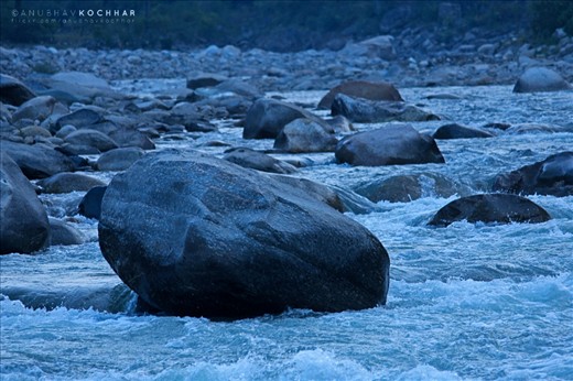 Frothing Mandakini. Water Burbling and Frothing Through the River Mandakini, Syalsaur, Uttrakhand. Mandakini is the most calm and composed rivers which flows through the Indian Himalayas. Big stones become natural barriers of the river and the water flashes and slaps the biggest of stones forming froth.