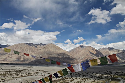 Prayer flags are called rlung-rta in Tibetan, meaning “wind horse” which is a mythical being adopted by Tibetan Buddhists . The tradition of hanging prayer flags on mountain passes, the rooftops of monasteries and houses, or spanning them from one treetop to the next is done so that the wind carries the special wishes, mantras, and auspicious symbols on them into the wide world . A journey to Ladakh is like a journey to ones eternal home.