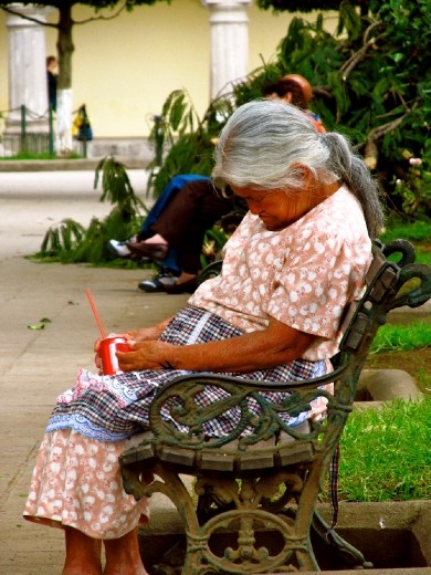 Caught taking a quick snooze in the square! I loved the contrast of the traditional Mayan outfit with her magnificent grey hair, sun weathered skin and the Western element of the easily recognizable global brand Coca Cola! 