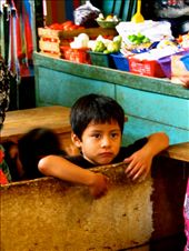 There is no greater way to view life than through a child's face. They have not yet learnt the social graces to hide their expression out of fear of society and judgement. This photograph stood out to me from our daily morning market visits. We would purchase fresh ingredients there from the local women for our delicious breakfasts (by far my favourite meal of the day!). I'll leave it up to you to interpret the thoughts behind this beautiful child's emotive eyes...: by aoifekk, Views[321]