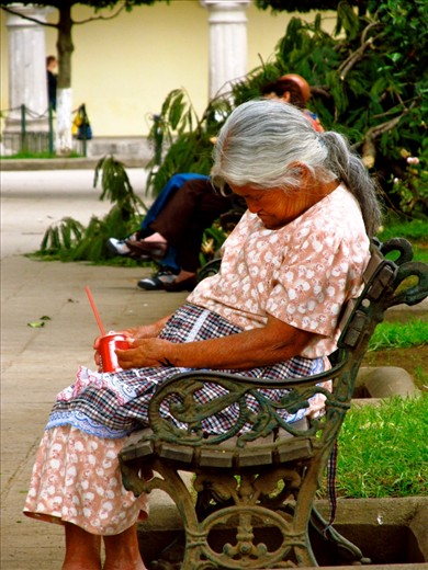 Caught taking a quick snooze in the square! I loved the contrast of the traditional Mayan outfit with her magnificent grey hair, sun weathered skin and the Western element of the easily recognizable global brand Coca Cola! 