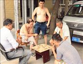 Beijingers love 象棋. 1 vs 1, on the street, but never less than 5 around a table: by aperrone, Views[503]