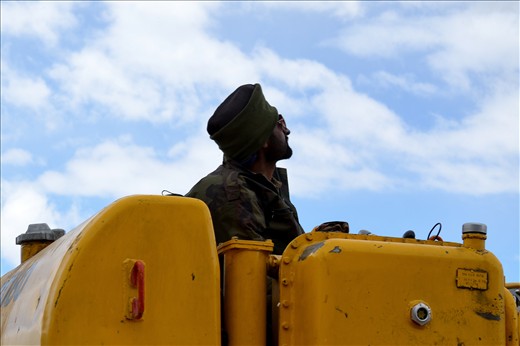 We cherish our conquests: A Sikh jawan hard at work to clear a treacherous mountain pass. The perpetual landslides inundating these mountains keep rendering the roads useless, and man in almost an act of defiance keeps building them back come hell or high water.