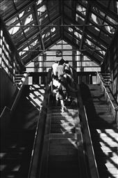 Commuters exit the bus and ride the escalator up to Market Street: by apricated, Views[273]