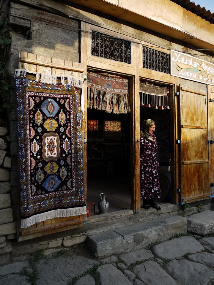 There aren't many people but everyday this woman guards the entrance to her shop