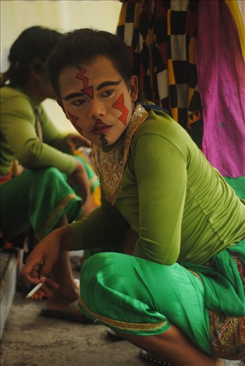 When the rain fell harder, they took shelter in front of closed shop and smoking. “Smoking make my mind clearer, just like all of my problems are gone,” this man said.