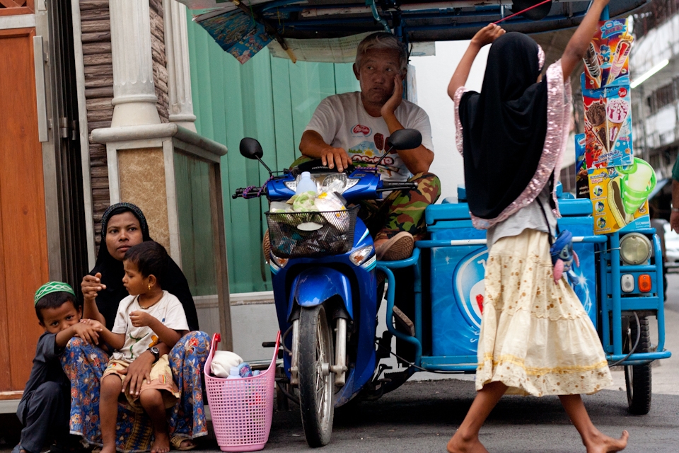 Around 5pm, the afternoon market begins, selling various kinds of foods. The market only occurs on Ramadhan month. An ice cream seller waiting for customer next to some beggars who some of them are kids. Many of those beggars brought along their kids to beg for money. It would increase the compassion for some money-givers.