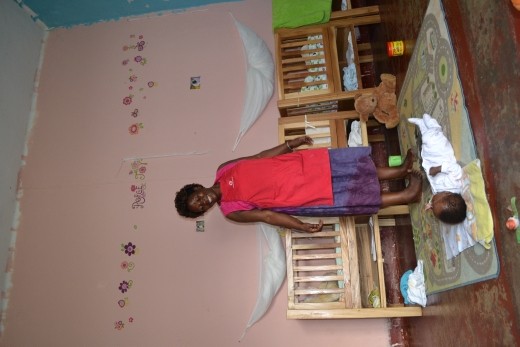 Aunty Margaret keeps watch over baby Christopher in the Premmie Babies Room