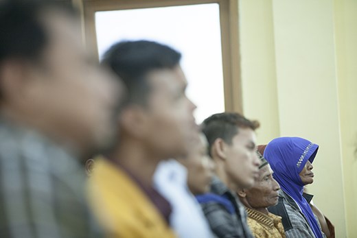 With her husband and other families, they attend high court for citizen-lawsuit.