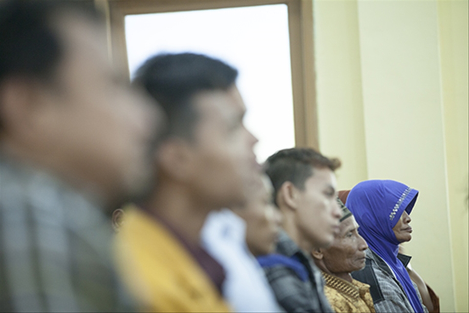 With her husband and other families, they attend high court for citizen-lawsuit.