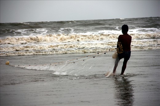 Local fisher man is busy in his work