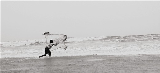 Local fisher man is busy in his work