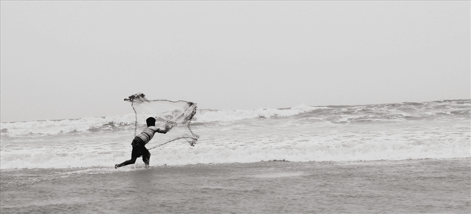 Local fisher man is busy in his work