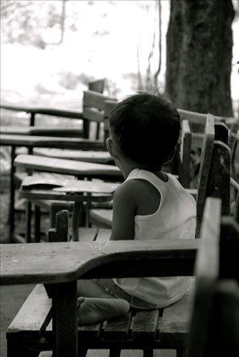 One of the children came early for the feeding program at the local school