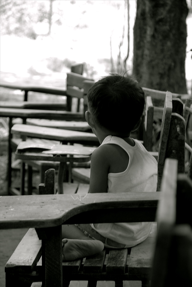 One of the children came early for the feeding program at the local school