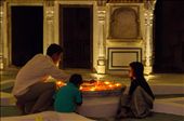 Candles are lit in the central courtyard of the haveli while my host’s two young children look on. I love the orange glow of the light reflecting up from the marigolds into her face and how intently her younger brother is observing the flames being transferred from one candle to the next. Many of the photographs I took that night are, like this one, focused in on the subject, highlighting small details in the scene that are so touching, emphasizing the intimacy of these family moments and taking advantage of the  beautiful candlelight.: by arwenjoyce, Views[451]