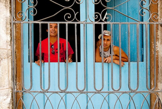 Two construction workers take a break from work to illustrate their opinions.