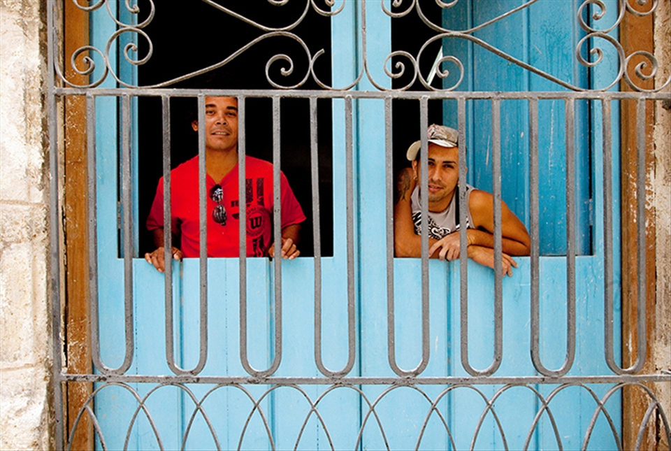 Two construction workers take a break from work to illustrate their opinions.