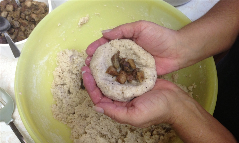 Adding the pork filling