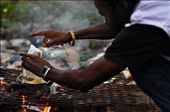A resident of Tent City prepares a pot of noodles atop a pile of burning garbage: by ashleyautumn, Views[273]