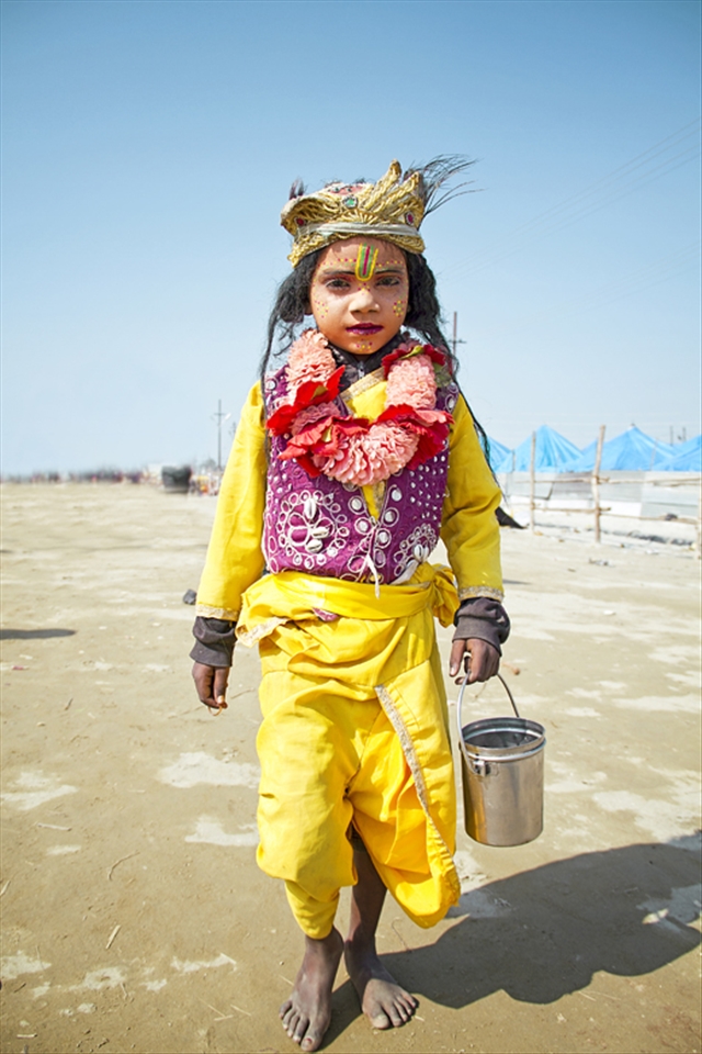 kid dressed up as Krishna - kumbh mela  