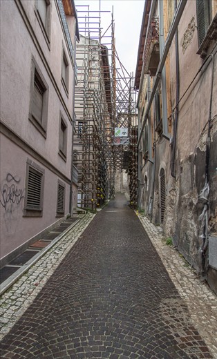 Another view of a building with Scaffolding's supporting the structure and also cracks can be seen in the walls. The earthquake made nearly made 70000 people homeless and killed around 300 people.  Many of the old structures were completely collapsed and the city is filled with cranes all over carrying out reconstructions and Scaffolding supporting each and every structure giving a deserted look to the whole city.