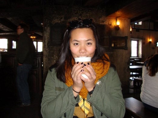 Sipping hot butterbeer at the Three Broomsticks in Hogsmeade.