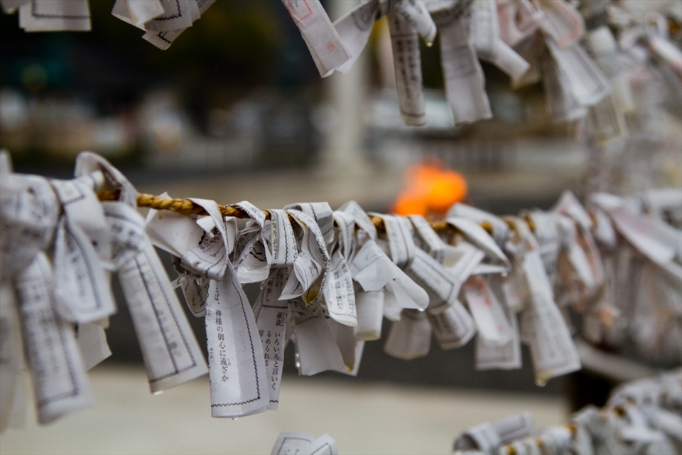 The O-mikuji prayer papers tied to wire outside of the Mitaki-dera temple in Hiroshima. 