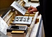 A local man completing his signed roof tile for the repair of the Great Buddha Hall at Todai-Ji Temple, Nara.: by aspiringnomad, Views[460]