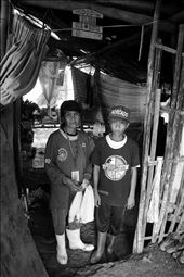 Rosario and her 15 year-old son Edgar prepare for another day at work in an open dumpsite in Rodriguez, Rizal. The tandem makes around 40 pesos a day (1 USD) scavenging for items among mountains of rubbish. This is the only source of income for many living in this community.: by atomaraullo, Views[452]