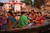 Locals ride a paddle boat to make an offering on the holy river: by atomaraullo, Views[281]
