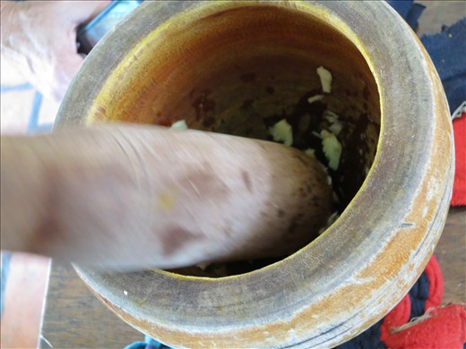 It is no easy feat by hand, but can also be done in a food processor. 