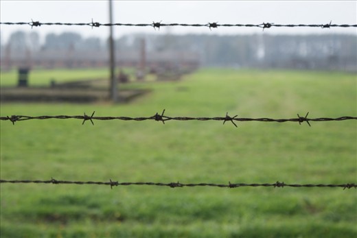 In Oświęcim, Poland, barbed wire separates arriving visitors from the vast area of the former concentration camp.