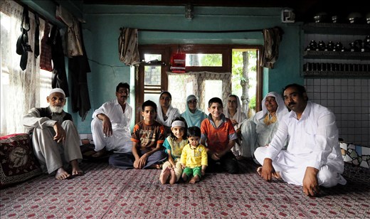 Family of a local Kashmiri man, having a shop at the Floating Market. Kashmiri people are known for their warm hospitality and this family was no exception.