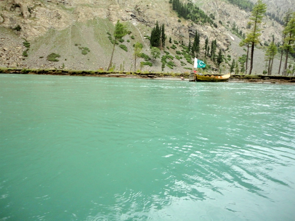 boat with Pakistani flag on a lake