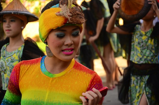 Someone might have text her something sweet to be smiling that way.