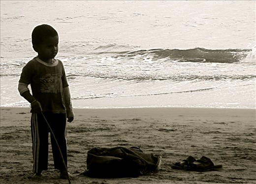 left to guard dad's belongings and play with a stick .. no our friend isn't happy with that