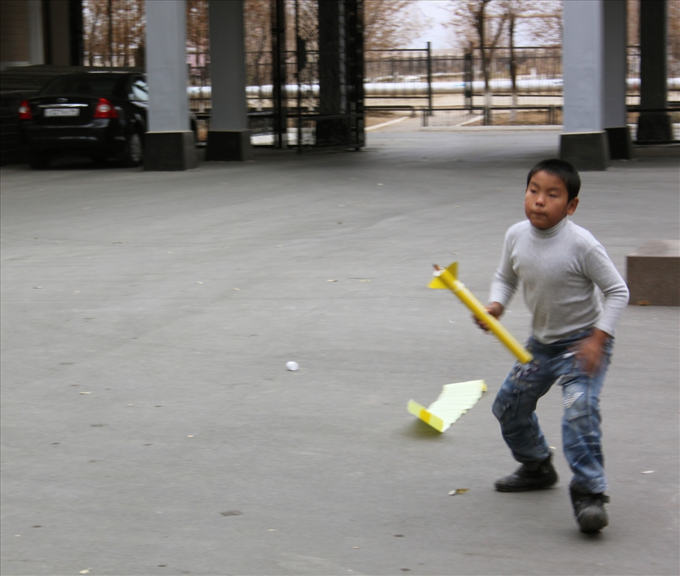 While on a tour of the International Space School, we were demonstrated the process of a rocket launch. Attendants had the opportunity to 'push the button' and launch models into air. This Kazakh boy was ready and on-the-go, collecting and playing with every rocket model that had fallen onto the launch site. 