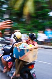 Down town Seminyak. - The Scooter is the transportation of choice in Bali, and it amazes me what people take on their scooters and how much they pile up on them. This lady was so relaxed sitting side saddle. : by balihigh, Views[531]