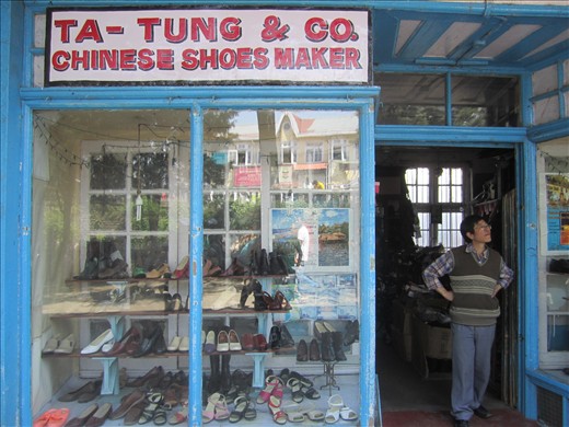 Mr. Peter Ta-Tung the Shoemaker watches the world go by. Leather, hand-stitched.