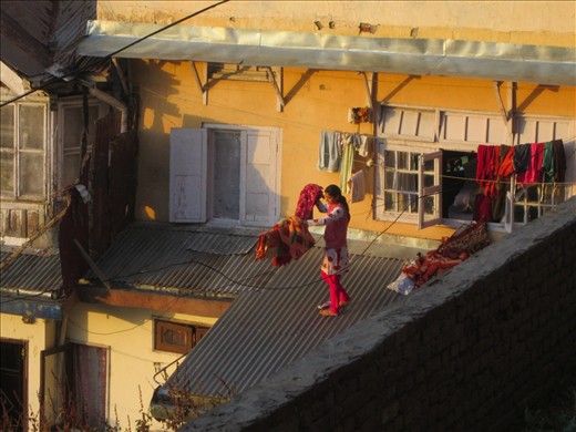 She jumped out the window! Tin roof porch, drying clothes.