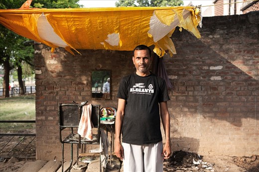 The street is a major place of commerce throughout India and it is not just unique to merchants. Barbers cluster in their respective spots along alleys, streets and highways. Their barber chairs accommodate their patrons and human hair meets dry earth throughout the day.