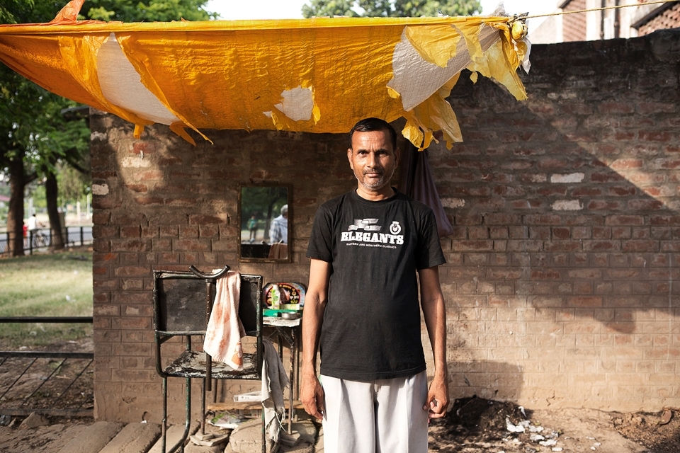 The street is a major place of commerce throughout India and it is not just unique to merchants. Barbers cluster in their respective spots along alleys, streets and highways. Their barber chairs accommodate their patrons and human hair meets dry earth throughout the day.