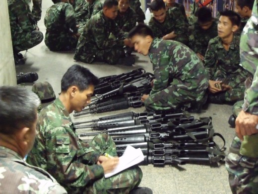 Soldiers taking stock of their equipment a few hours before the riot erupted. It is still in question now whether the soldiers were using only rubber bullets or live rounds.