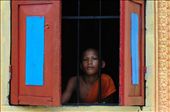 A young monk stares out the window of a temple oblivious. I held up my camera toask permission for a photo. There was absolutley no reaction, as if he was entranced. So I took a few photos and left him to his contemplation. Siem Reap - Cambodia: by barendjr, Views[318]