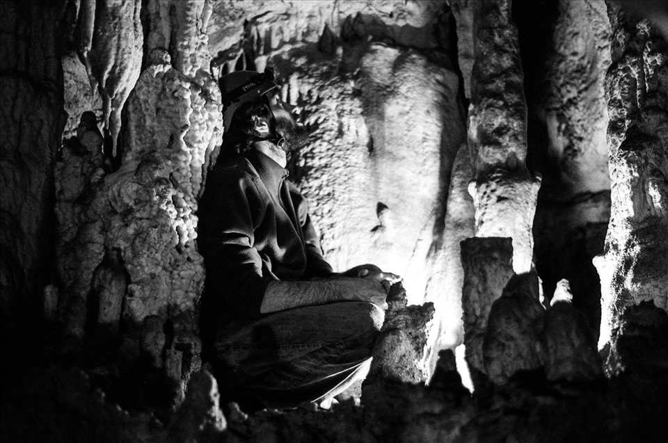 Speleologist admiring the geologic formations