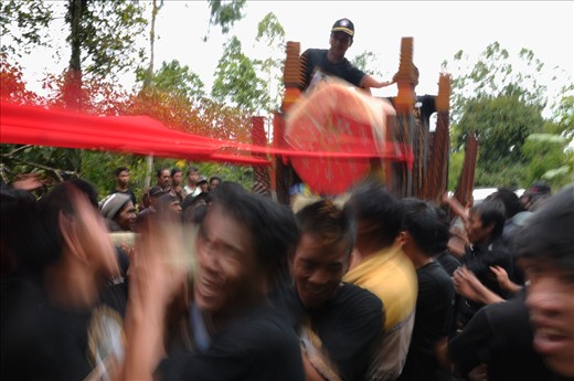 Coffin in procession by the family. The family should not feel sad