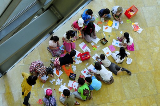 Children learning the essence of art in a building made of pure art